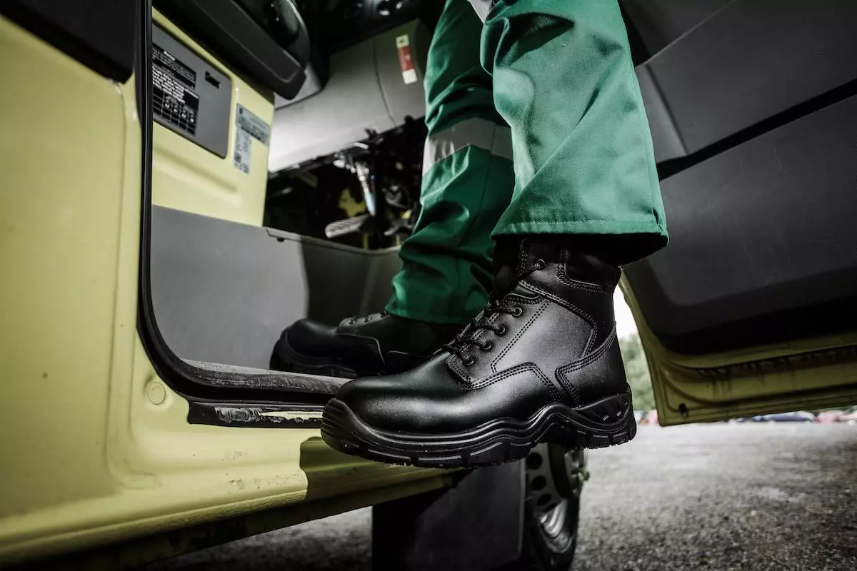 A paramedics feet stepping into an ambulance
