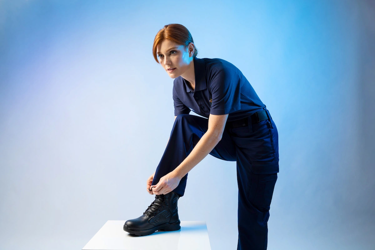A Person tying their shoelace